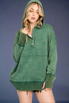 Oversized green mineral washed hoodie with side pockets and ribbed detailing. 