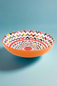 A colorful zigzag pattern salad bowl.