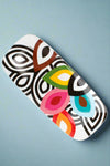 This long, rectangular serving platter features a multicolor pattern on a white background.