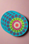 A set of brightly colored dinner plates with polka dot print.