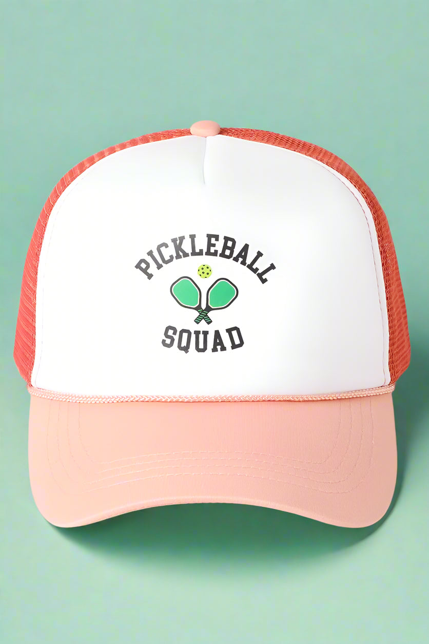 An adjustable rose and white trucker hat with ‘Pickleball Squad’ and a picture of pickle ball addles on the front.