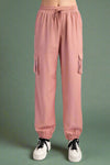 Pink cargo pants on a white background