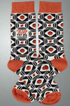 These tall black, white and orange socks say I’m Too Sexy For My Socks.