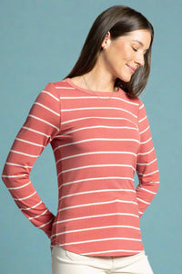Woman wearing a red and white striped long-sleeve shirt against a gray background