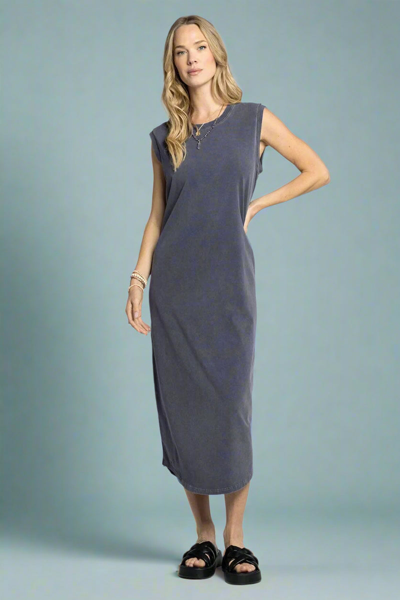 Woman wearing a gray sleeveless dress on a white background