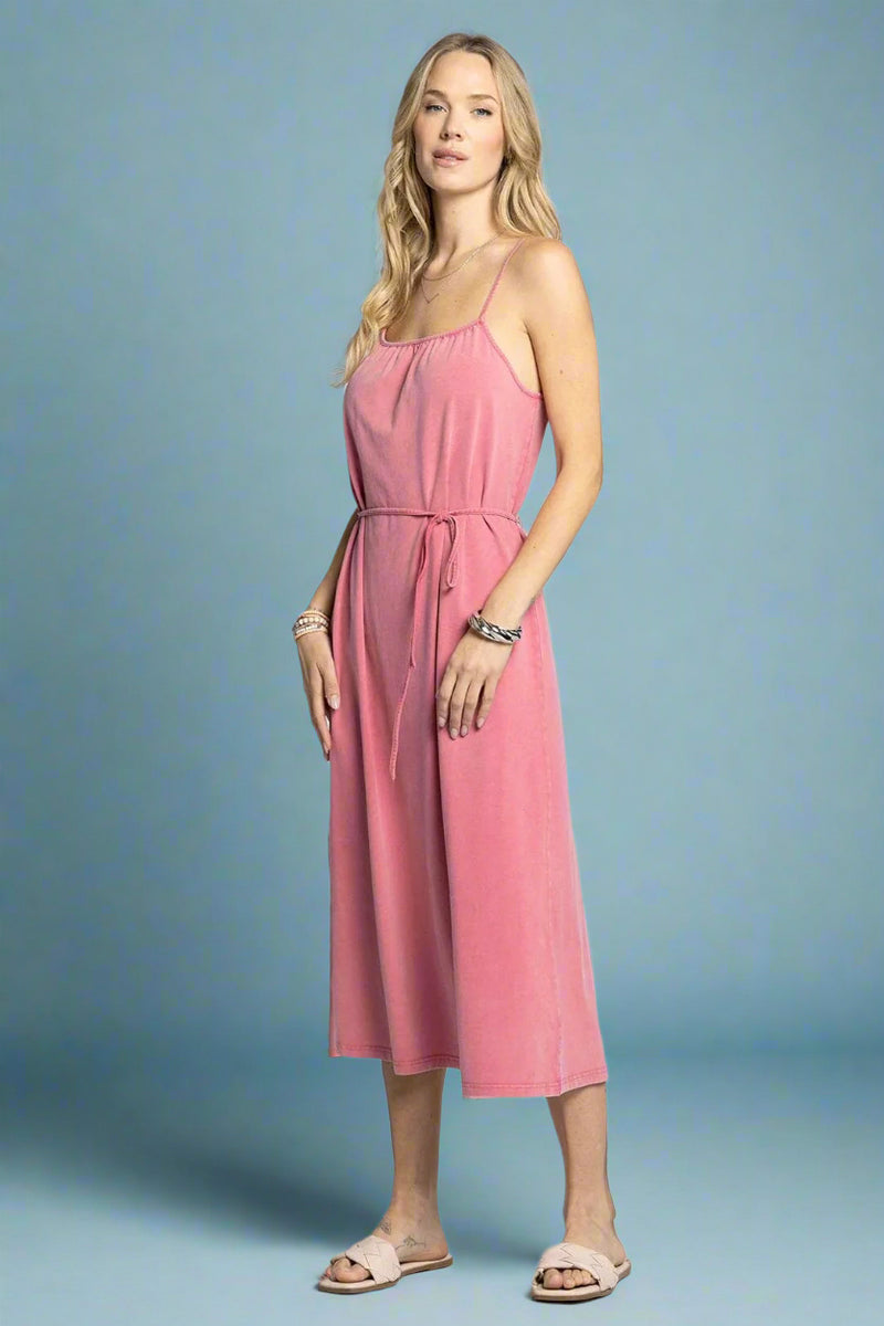 Woman wearing a pink dress on a white background