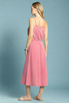 Woman wearing a pink dress on a white background