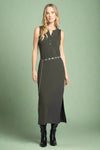Woman wearing a sleeveless green dress with a chain detail on a white background