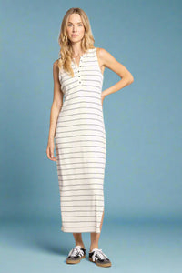 Woman wearing a white and beige striped dress on a white background