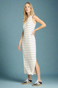 Woman wearing a striped dress with a white background
