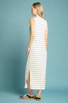 Woman wearing a sleeveless striped dress on a white background
