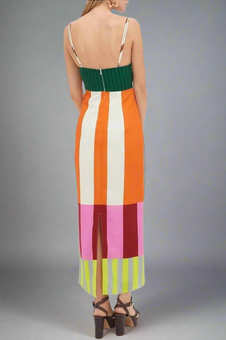 Multicolored striped dress with thin straps on a white background