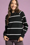 A women’s classic lightweight hooded sweatshirt in buttery soft black material with white stripes and raglan style sleeves.