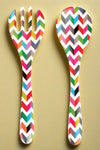 A colorful zigzag pattern salad server set.