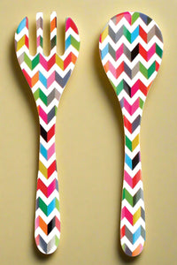 A colorful zigzag pattern salad server set.