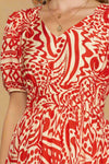 Red and white patterned dress worn by a person