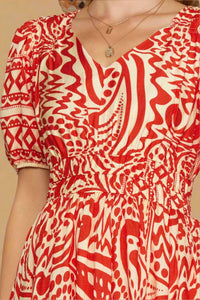 Red and white patterned dress worn by a person
