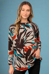 A long sleeve crew neck top with a brown, teal, and ivory abstract pattern. It is a loose fit top made of light material.