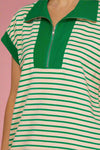 Green and white striped dress with a zipper detail on a plain background