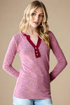 Soft ribbed V-Neck henley top with raw hem detail. Full length with long sleeves. 