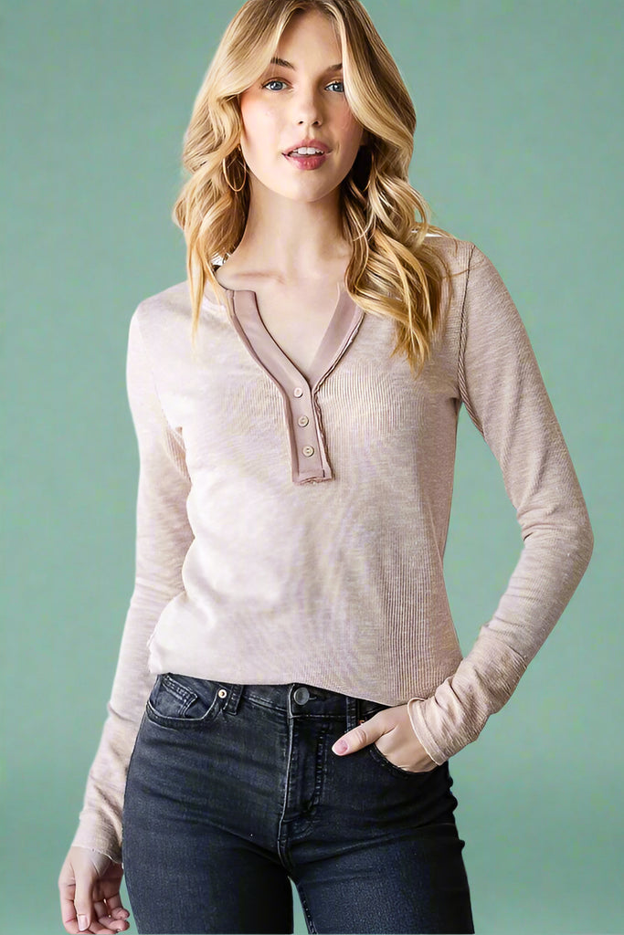 Taupe colored V-neck henley top in a soft ribbed material with a raw hem detail. 