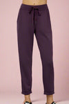 Buttery soft plum colored joggers with side pockets, a tapered leg, and tie waist. 