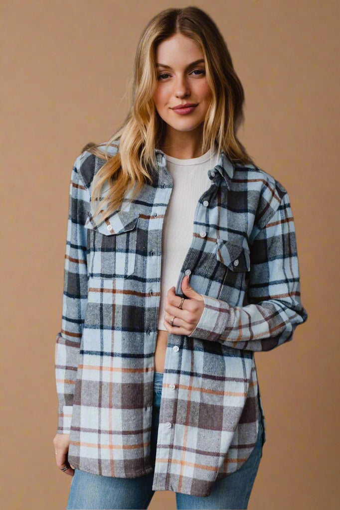 Model is wearing a flannel that features an ombre effect.