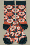High patterned navy and orange socks that say “Wore my big girl socks.”