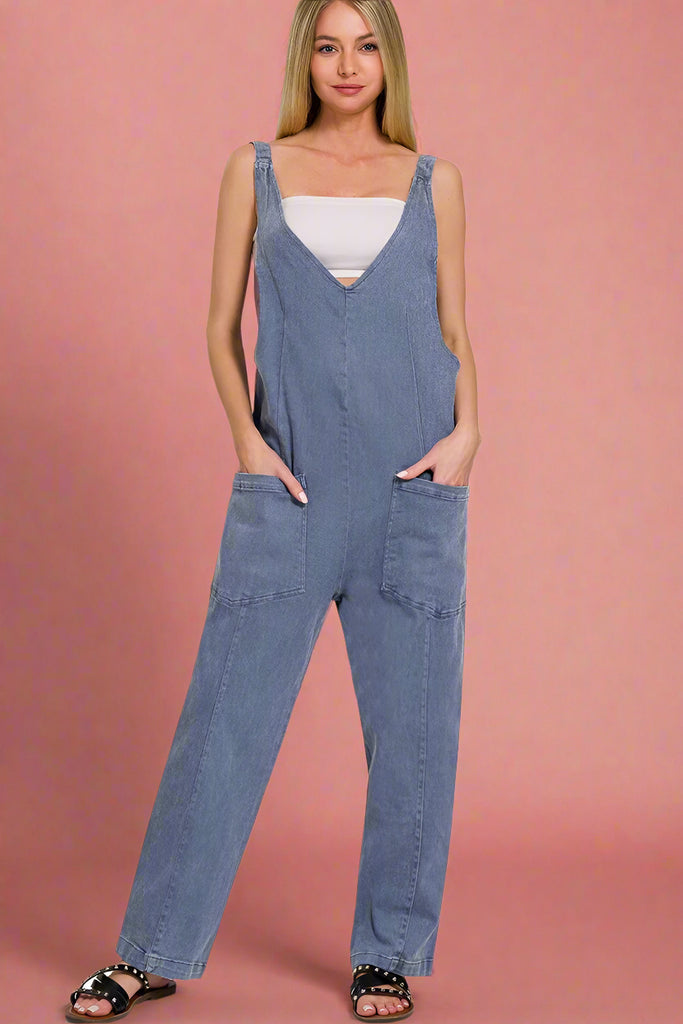 Blackberry colored garment dyed baggy denim jumpsuit with adjustable straps. V-neck line in the front and scoop design in the back.