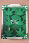 A food grade silicone pot leaf muffin mold in the color green.