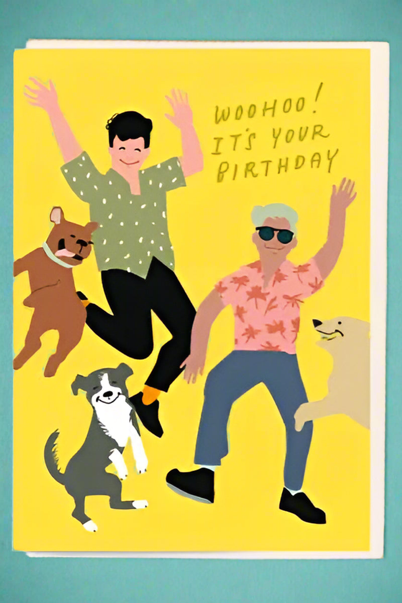 A greeting card with two men and three dogs partying and text that reads ‘WooHoo! It’s Your Birthday’.