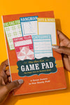 Cover of On-The-Go Game Pad: The Paper Cure for Restless Minds, a notepad of games played on paper.
