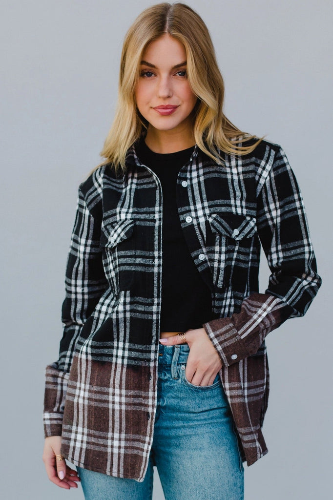 Model is wearing a flannel that features an ombre effect.