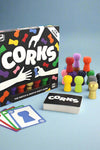 A card game that requires you to get a cork before your opponents. Speed and skill are required. Game for 6 years+ and 3-14 players.