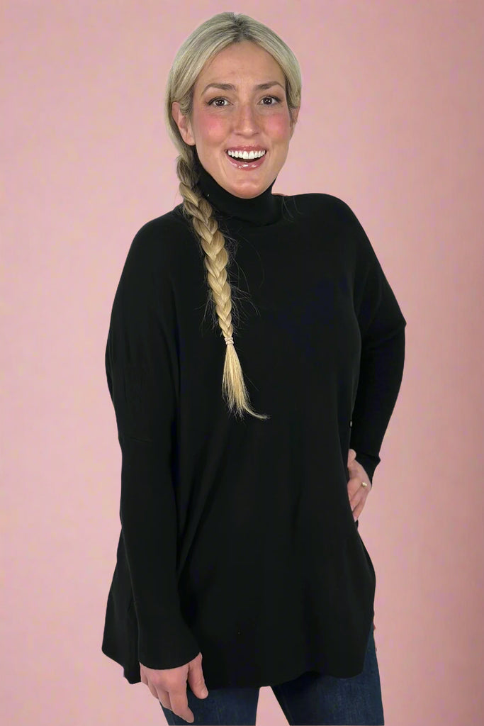 Long sleeve turtleneck sweater with dolman sleeve details. Buttery soft and light weight material. 