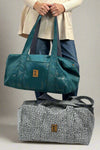 A duffel bag in blue dream or slate croc pattern. Made by New Hope Girls.