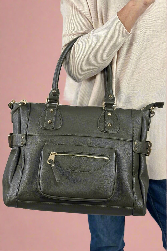 An olive color bag made of vegan leather. It has a shoulder or crossbody strap.