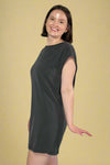 Model is wearing a sleeveles black mini dress. 