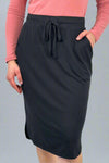 A women’s relaxed fit pencil style skirt in black with elastic tie waist and tulip hem.