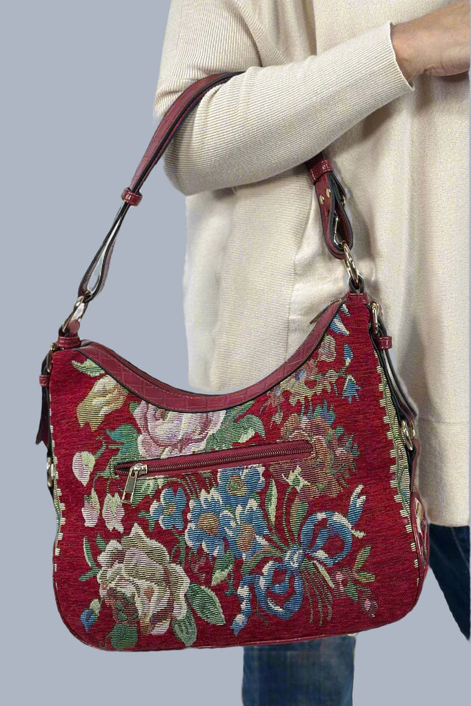 Red floral jacquard hobo bag featuring hand beaded details. 