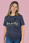 A women’s basic crewneck tee shirt in a heathered navy color featuring Door County written over WI lettering graphic on the front.