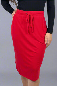 A women’s relaxed fit pencil skirt in red with elastic tie waist and tulip hem.