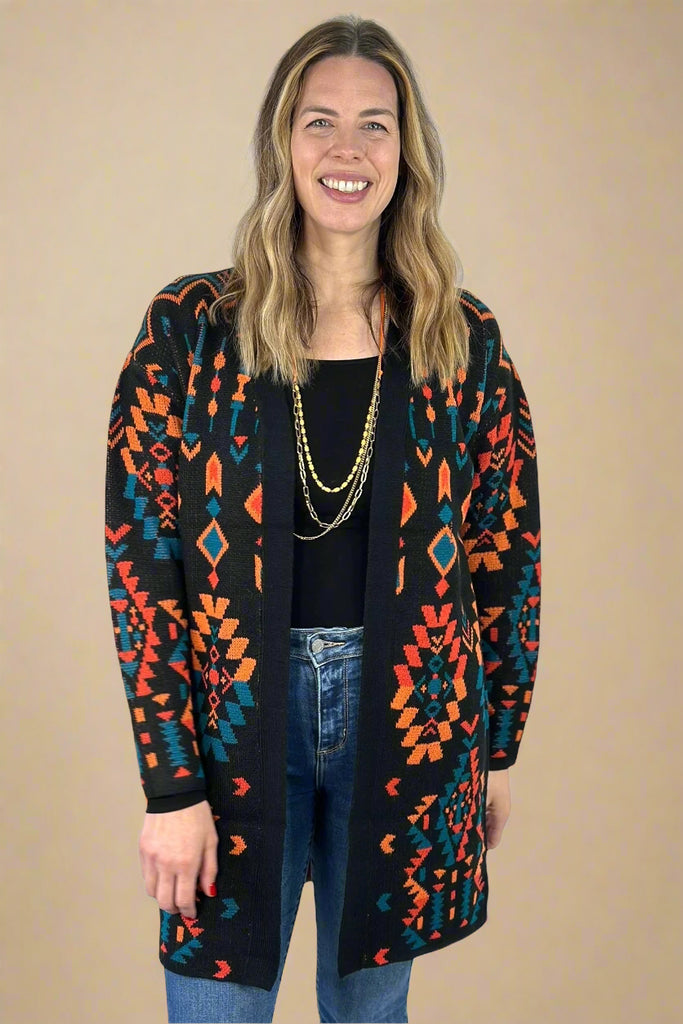 Black, orange, and teal Aztec print knee length open cardigan. Medium weight, long sleeve.