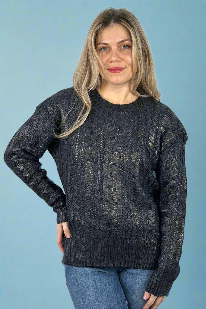 Cire Fabric cable Knit Round Neck pullover Sweater featuring a metallic sheen and side vents for comfort and ease of movement. 