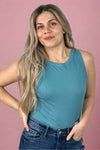 A fitted, ribbed tank with a high neckline in teal.