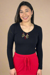 A women’s basic fitted long sleeve v-neck tee in black.