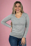 A women’s basic fitted long sleeve v-neck tee in light heather grey.