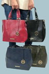 Faux leather snakeskin purse. Top handles with an "M" keychain on the front and a small pouch included inside. 
