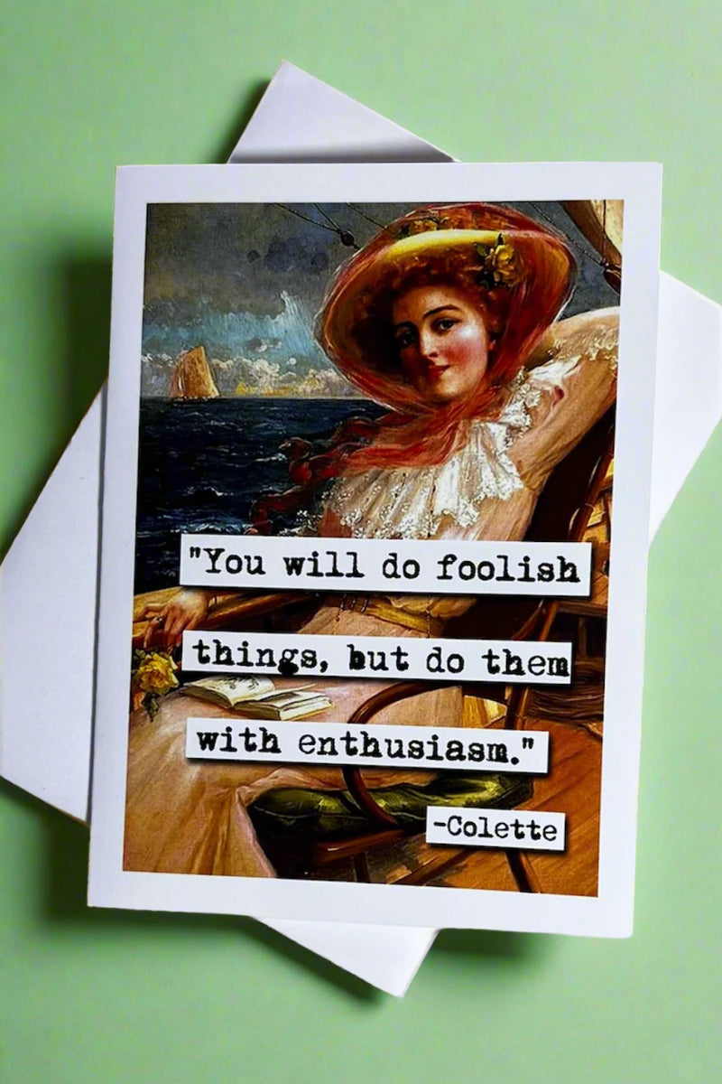 A greeting card with the image of a classical style painting with woman lounging on a cruise and typewriter text pasted over that reads ‘“You will do foolish things, but do them with enthusiasm.” - Colette’.