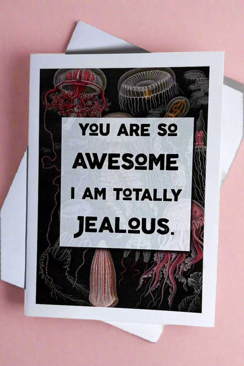 A card with a background image of jellyfish that says “You are so awesome I am totally jealous.“